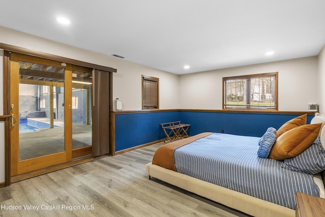 bedroom with visible vents, wood finished floors, access to outside, and recessed lighting