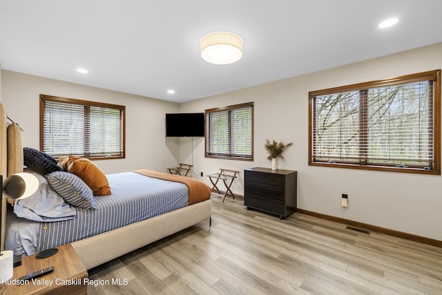 bedroom featuring baseboards, visible vents, recessed lighting, and light wood-style floors
