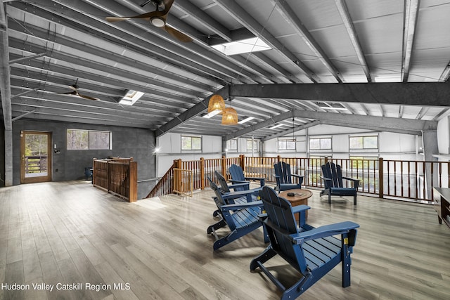 interior space with ceiling fan