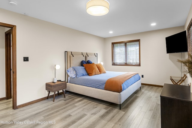 bedroom featuring recessed lighting, light wood finished floors, and baseboards