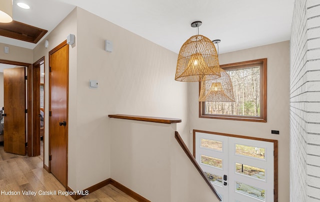 interior space featuring wood finished floors and baseboards