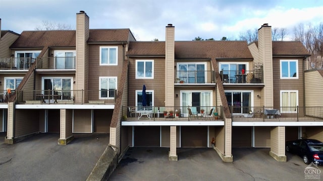 85 Riverview, Port Ewen, NY 12466 - rear view of house with an attached garage and driveway