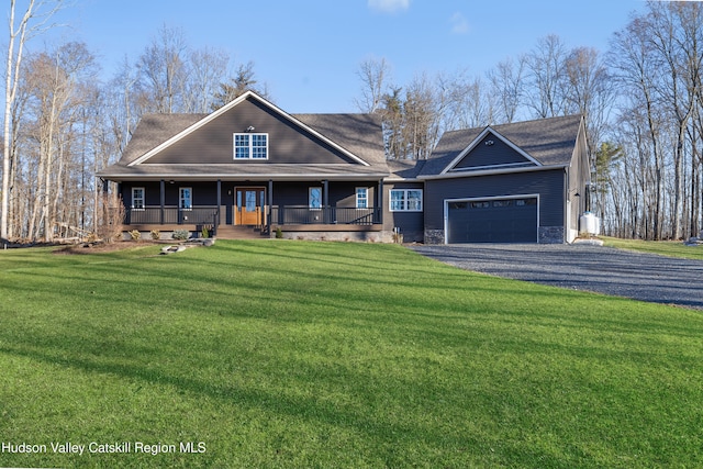 view of front of home featuring aphalt driveway, a porch, a front yard, stone siding, and an attached garage