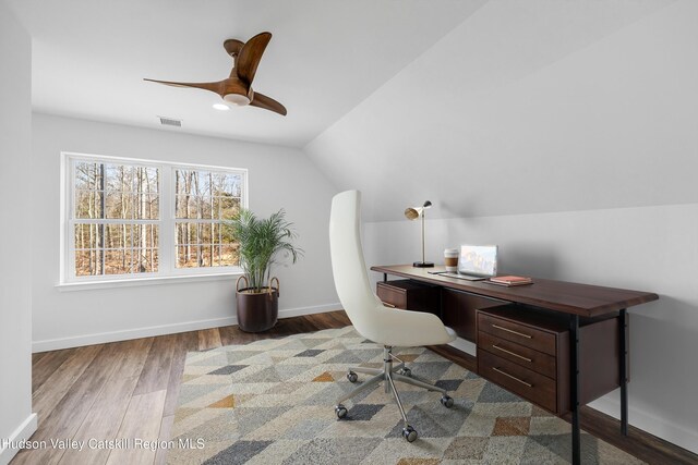 bedroom featuring vaulted ceiling and hardwood / wood-style floors