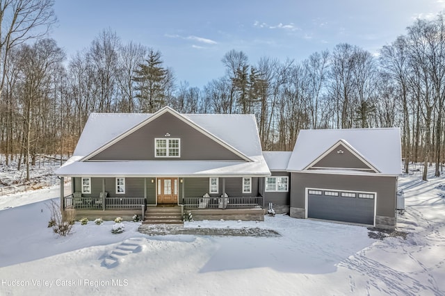 view of front of house featuring a porch and a garage