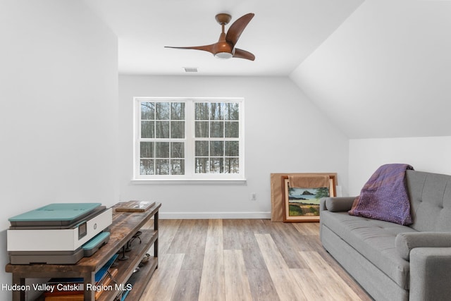 sitting room with vaulted ceiling, ceiling fan, and light hardwood / wood-style flooring