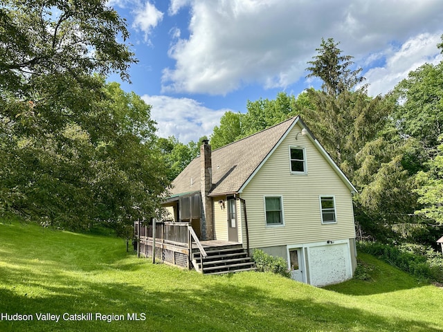 515 Delaware Ave, Andes, NY 13731 - rear view of house featuring a chimney, an attached garage, a yard, and a deck