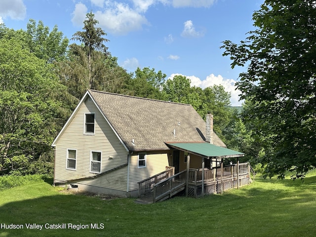 515 Delaware Ave, Andes, NY 13731 - back of house featuring a wooden deck, a yard, a chimney, and a shingled roof
