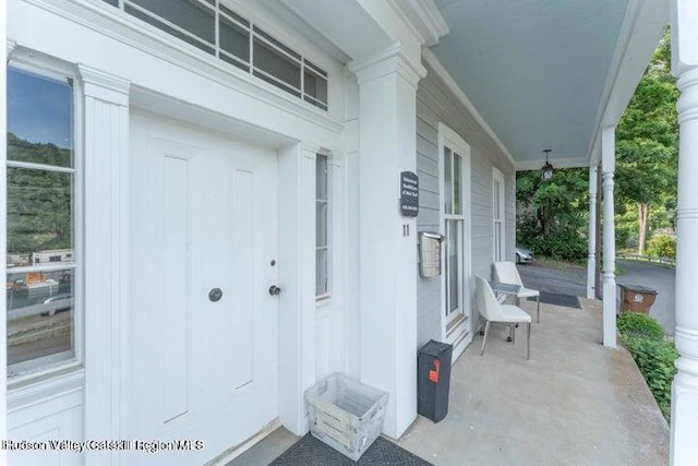 property entrance featuring covered porch