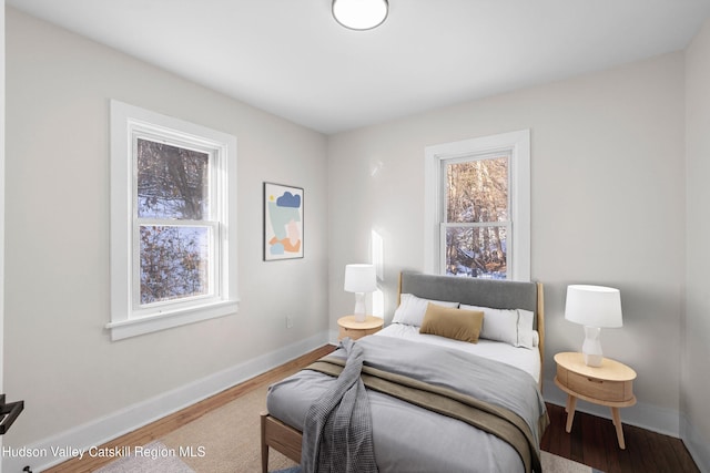 bedroom featuring wood-type flooring