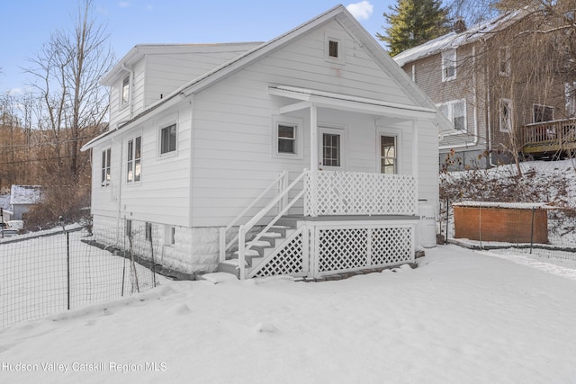 view of snow covered house