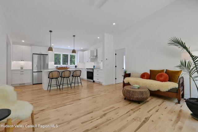 377 Pennsylvania Ave, Palenville, NY 12463 - living room featuring light wood-style flooring and recessed lighting
