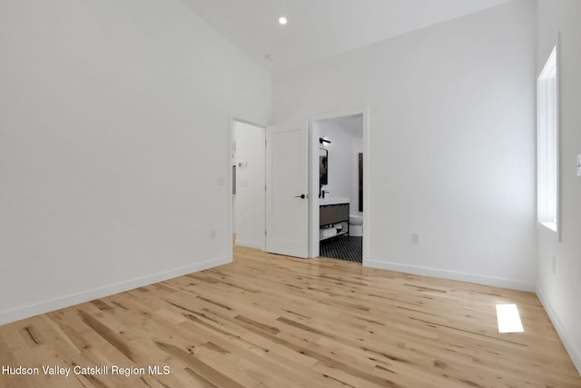 377 Pennsylvania Ave, Palenville, NY 12463 - unfurnished room with light wood-style floors, a towering ceiling, and recessed lighting