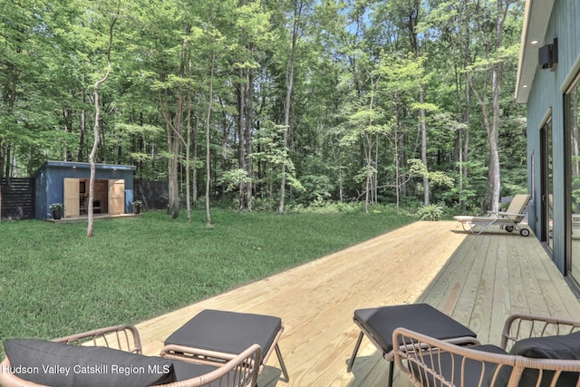 377 Pennsylvania Ave, Palenville, NY 12463 - wooden terrace with a storage shed, a yard, and a view of trees