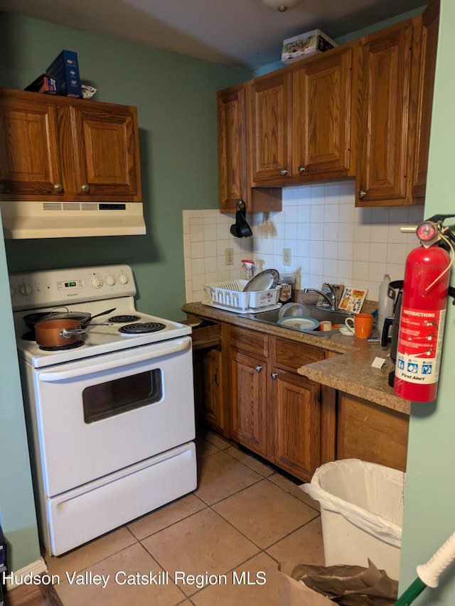 kitchen featuring backsplash, white electric range oven, ventilation hood, sink, and light tile patterned flooring