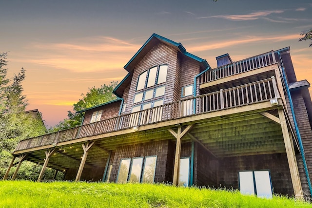 19 Twin Maples Ln, Windham, NY 12496 - back of property at dusk featuring a wooden deck