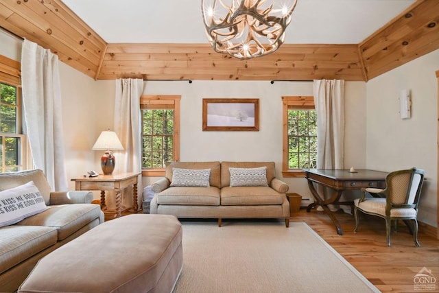 19 Twin Maples Ln, Windham, NY 12496 - living room featuring a chandelier, wood finished floors, and healthy amount of natural light