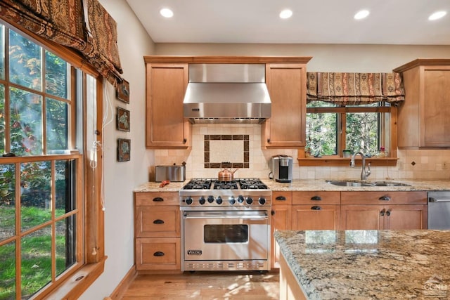 19 Twin Maples Ln, Windham, NY 12496 - kitchen with wall chimney exhaust hood, appliances with stainless steel finishes, a sink, recessed lighting, and light stone counters