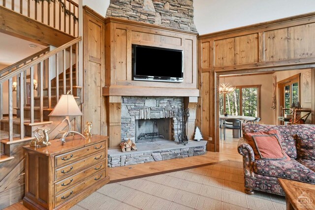 19 Twin Maples Ln, Windham, NY 12496 - living room featuring stairway, wood finished floors, and a fireplace