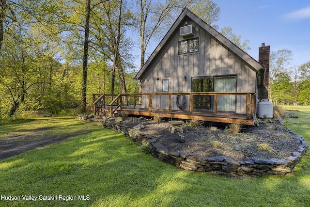 172 Stone Dock Rd, High Falls, NY 12440 - rear view of house with a lawn, a wooden deck, and a chimney