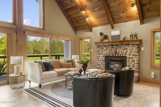 172 Stone Dock Rd, High Falls, NY 12440 - living area featuring light tile patterned floors, wood ceiling, high vaulted ceiling, beam ceiling, and baseboards
