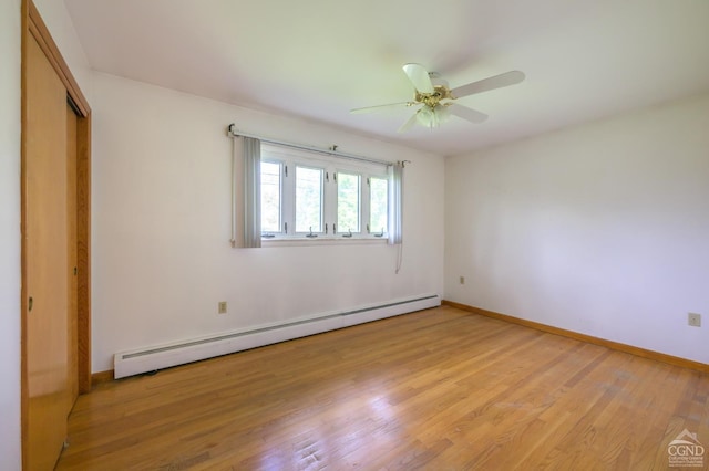 460 Joslen Blvd, Hudson, NY 12534 - unfurnished bedroom featuring a baseboard heating unit, light wood-style floors, a closet, baseboards, and a ceiling fan