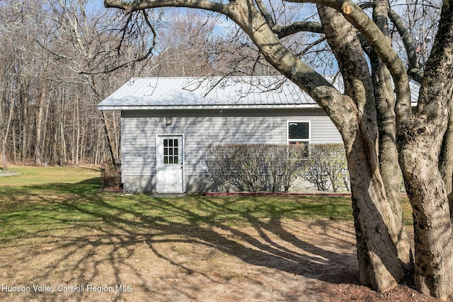 view of outdoor structure with a lawn