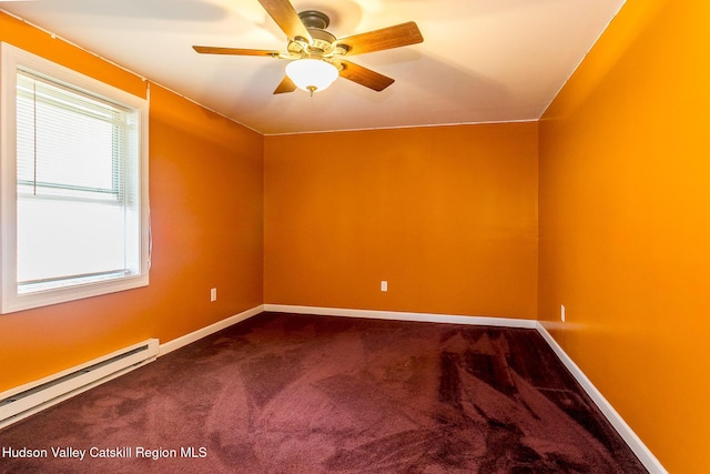 unfurnished room with carpet, a healthy amount of sunlight, and a baseboard heating unit