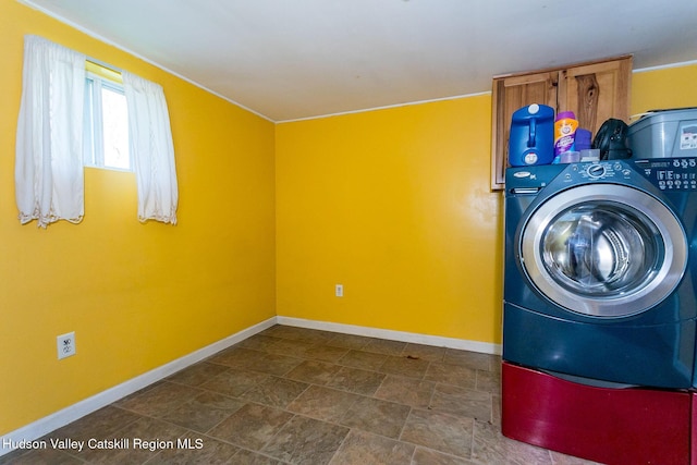 clothes washing area featuring washer / clothes dryer