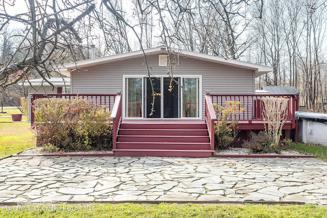 rear view of house with a deck