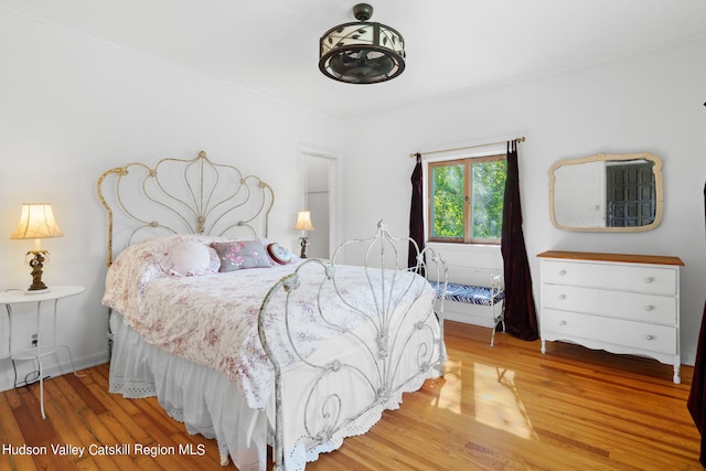 bedroom featuring wood-type flooring