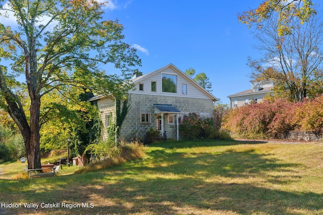 view of front of home with a front yard