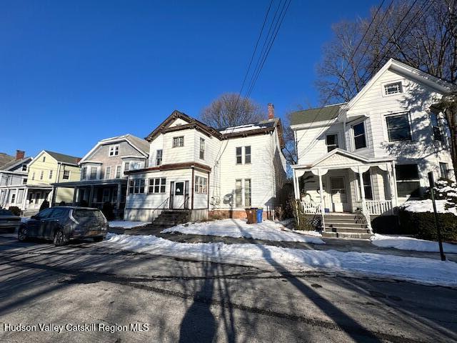 view of front of house featuring covered porch and a residential view