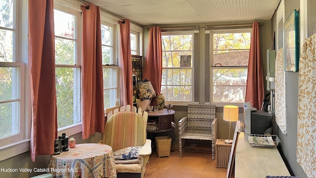 sunroom / solarium featuring a healthy amount of sunlight