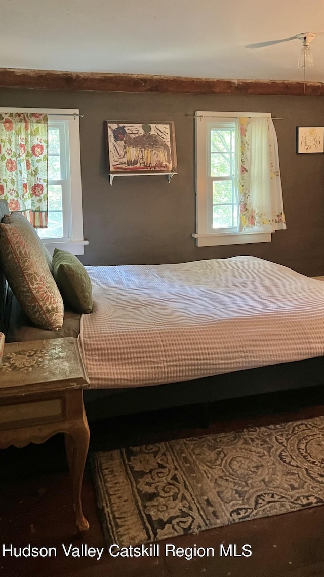 bedroom featuring multiple windows