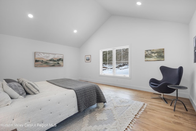 bedroom with high vaulted ceiling, recessed lighting, wood finished floors, and baseboards