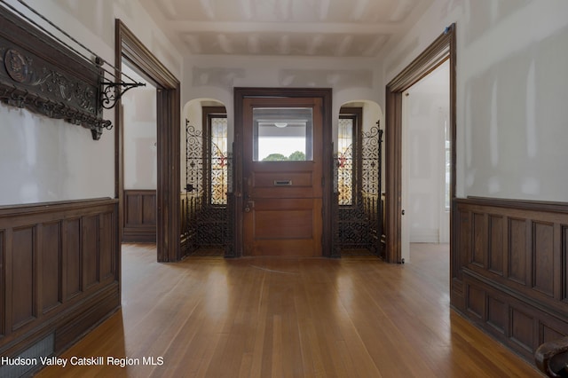 12 W Chestnut St, Kingston, NY 12401 - entrance foyer with arched walkways, wood-type flooring, and wainscoting
