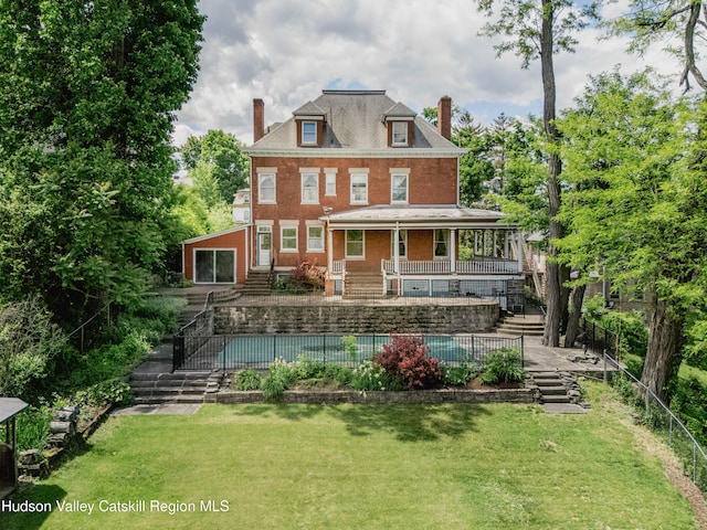 12 W Chestnut St, Kingston, NY 12401 - rear view of house featuring stairs, a chimney, and brick siding