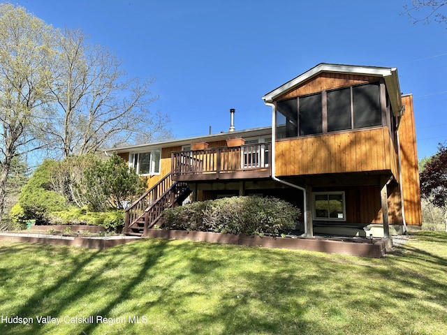 36 Susi Oval, Modena, NY 12548 - rear view of house featuring a deck, a yard, stairs, and a sunroom