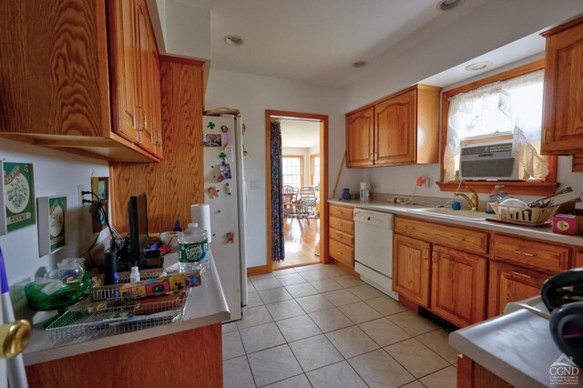 10345 Rte 32, Greenville, NY 12431 - kitchen featuring white appliances, a sink, light tile patterned floors, brown cabinets, and light countertops