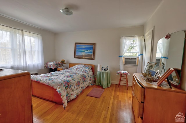 10345 Rte 32, Greenville, NY 12431 - bedroom with light wood-style floors, cooling unit, and baseboards