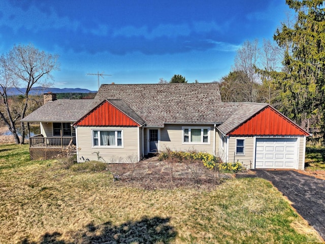 10345 Rte 32, Greenville, NY 12431 - view of front of property featuring board and batten siding, asphalt driveway, a shingled roof, a front lawn, and a garage