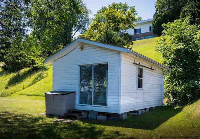 view of property exterior with a yard