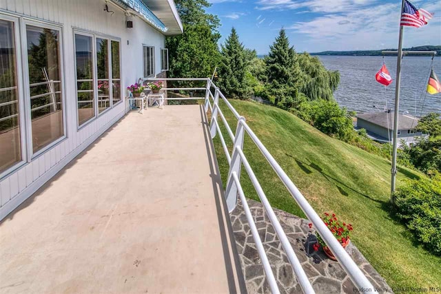 balcony featuring a water view