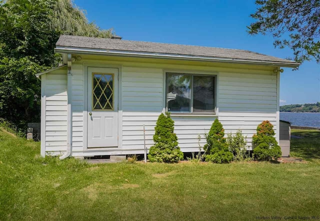 view of property exterior with a lawn