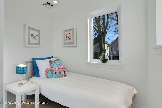 bedroom featuring multiple windows