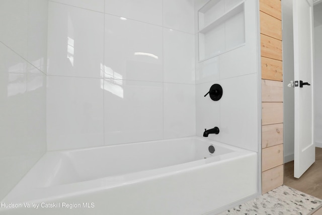 bathroom featuring bathing tub / shower combination