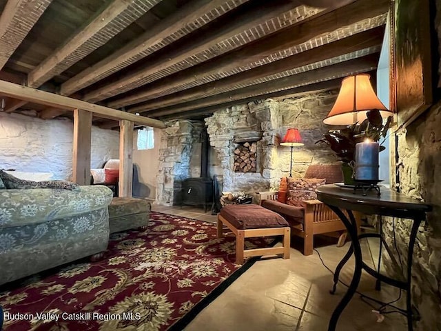 sitting room with concrete floors and a wood stove