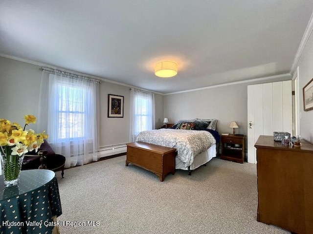 bedroom with a baseboard heating unit, carpet floors, and ornamental molding