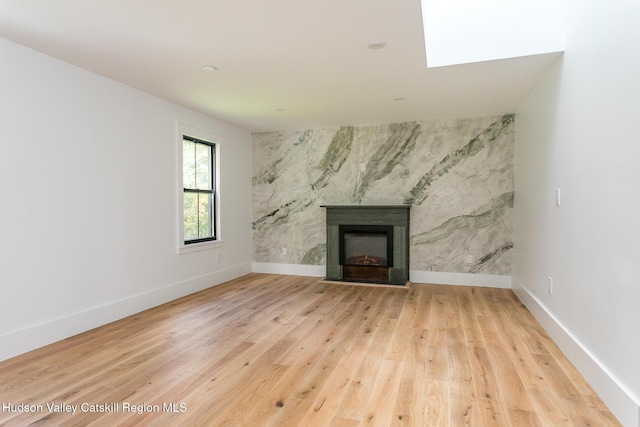 unfurnished living room with light wood-type flooring